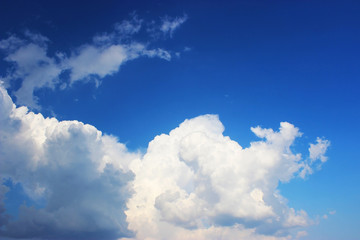 Naklejka na ściany i meble blue sky clouds, blue sky with unusual shaped clouds.