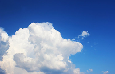 blue sky clouds, blue sky with unusual shaped clouds.