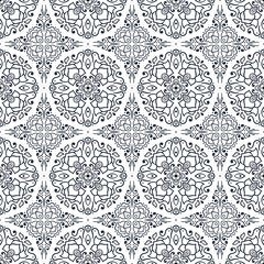 Seamless ornament of swirling lines, silhouettes flowers.  Print for the cover of the book, postcards, t-shirts. Illustration for rugs.
