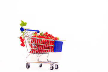 Cart with berries on a white background red currant . Summer berry. Red berries are a whole...