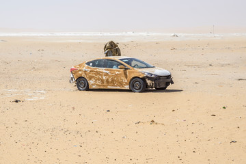 Abandoned refugee vehicles in the sahara Desert, Chad