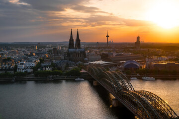 Fototapeta na wymiar panorama view of Cologne Cathedral and Hohenzollern Bridge at sunset, Germany