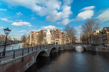 Fototapeta premium Amsterdam canal in sunny day, Amsterdam is the capital and most