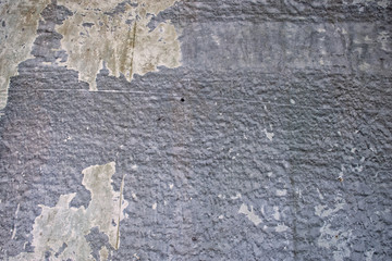 Abstract concrete wall with remnants of old paint (grunge effect)