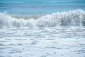 Curve of ocean wave with splash of water, Thailand