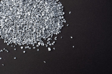 Silver granules on gray background