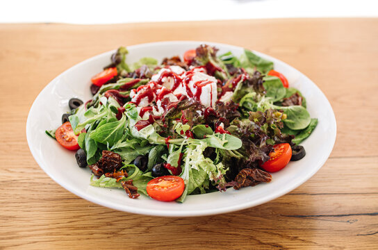 Fresh salad with cheese and tomatoes