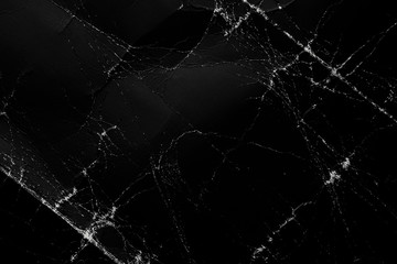 Old shabby folded surface of dark black paper