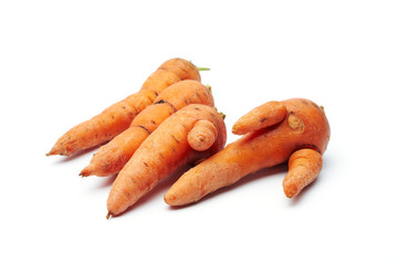 Heap of fresh raw carrots isolated on white background