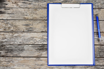 Clipboard with blank white paper with pen