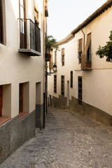 Cozy empty street in city center of Granada Spain summer evening