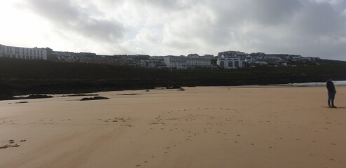Sandy Cornish beach during a windy and wintery British season