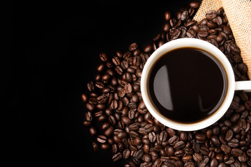 Cup of coffee with coffee beans background
