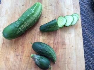Homegrown cucumbers on shitty cutting board