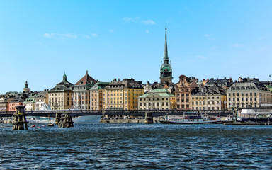 Fototapeta premium A view from a boat toward the shore of the Swedish capital, Stockholm in the summertime