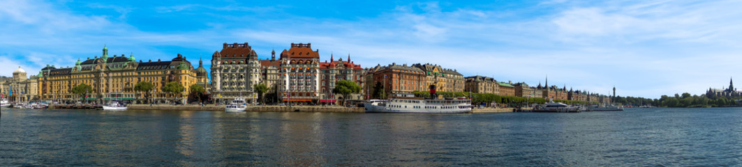 Naklejka na ściany i meble A panorama view along the waterfront of the Swedish capital, Stockholm in the summertime