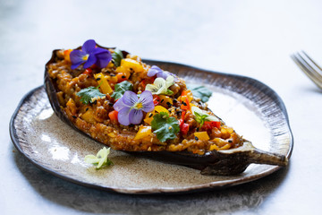 Aubergine curry served in the aubergine skin