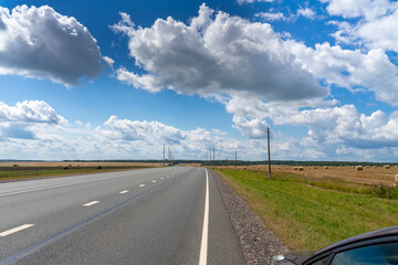asphalt road in the countryside. beautiful sky