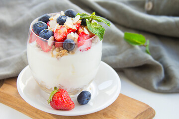 Healthy blueberry, strawberry and walnut parfait in a glass 