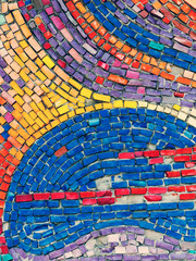 Detail of beautiful old collapsing abstract ceramic mosaic adorned building. Venetian mosaic as decorative background. Selective focus. Abstract Pattern. Abstract mosaic colored ceramic stones