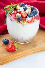 Healthy blueberry, strawberry and walnut parfait in a glass 
