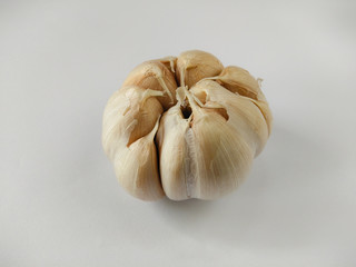 Closeup garlic (Allium sativum) on a white background. garlic as a seasoning for flavoring food