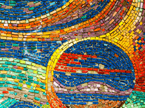 Detail of beautiful old collapsing abstract ceramic mosaic adorned building. Venetian mosaic as decorative background. Selective focus. Abstract Pattern. Abstract mosaic colored ceramic stones