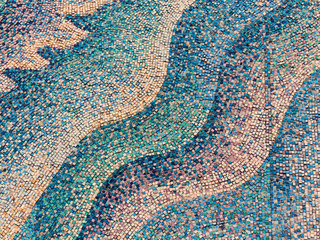 Detail of beautiful old collapsing abstract ceramic mosaic adorned building. Venetian mosaic as decorative background. Selective focus. Abstract Pattern. Abstract mosaic colored ceramic stones