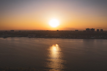 Naklejka premium big sunset over the river