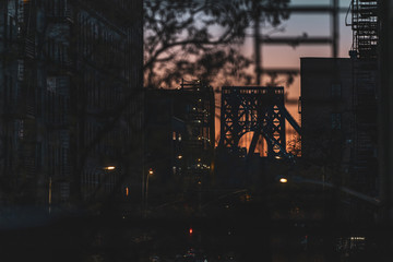 Sunset through the fire escape to the bridge view