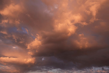 Naklejka na ściany i meble Heaven. Epic Dramatic yellow orange sunset storm cumulus clouds in sunlight
