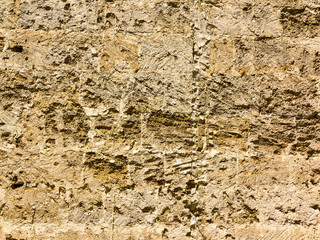 Abstract background of the old wall of black natural stone with cracks and scratches. Landscape style. Great background or texture.