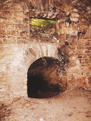 Mystic interior of an ancient dungeon. An old abandoned tunnel in an underground wine cellar....