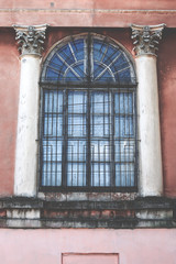 Fototapeta na wymiar Window. Metal bars on the window border of the old concrete wall production facilities