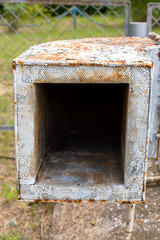 Old rusty ventilation duct mine with grey cracked paint, dust and scratches. Mine ventilation. Air ducts and ventilation system of the building.