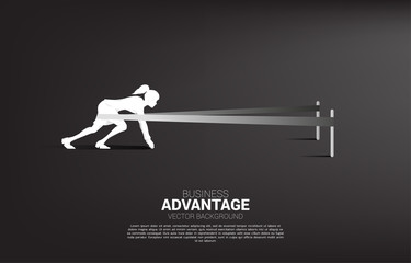 Business concept of and business advantage. Silhouette of businesswoman ready to run with catapult sling shot