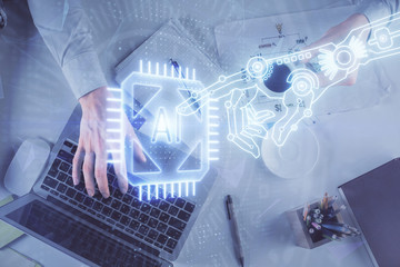 Double exposure of man's hands typing over computer keyboard and data theme hologram drawing. Top view. Technology concept.