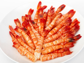 Tiger prawns. Delicious gourmet food on the table. Gourmet cuisine in white dish. Creative restaurant concept.