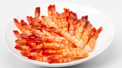 Tiger prawns. Delicious gourmet food on the table. Gourmet cuisine in white dish. Creative restaurant concept.