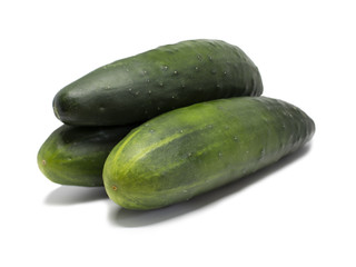 Three whole cucumbers stacked on top of each other