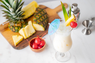 authentic pina colada cocktail with pineapple background