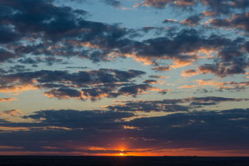 Beautiful atmospheric dramatic clouds in the evening at sunset.