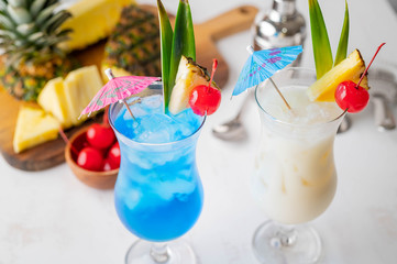 Summer cocktail image, pina colada and blue hawaii