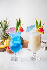 Summer cocktail image, pina colada and blue hawaii