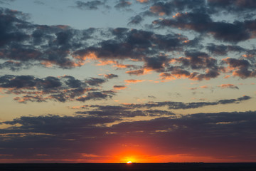 Beautiful atmospheric dramatic clouds in the evening at sunset.