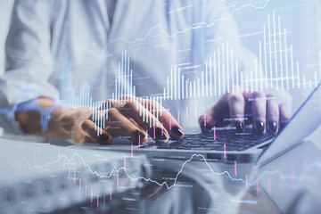 Double exposure of woman hands typing on computer and forex chart hologram drawing. Stock market invest concept.