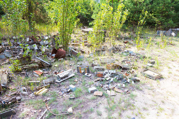 Radioactive dead zone of Chernobyl. Abandoned looted appliances, cars, electronics in Chernobyl accident. Consequences of evacuation, looting and vandalism after an explosion