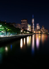 Fototapeta premium View on Financial District at night with long exposure from Hudson river