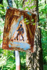 Old rusty metal signs in the Chernobyl zone. Radioactive area. Warning about dangerous area