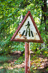 Old rusty metal signs in the Chernobyl zone. Radioactive area. Warning about dangerous area
